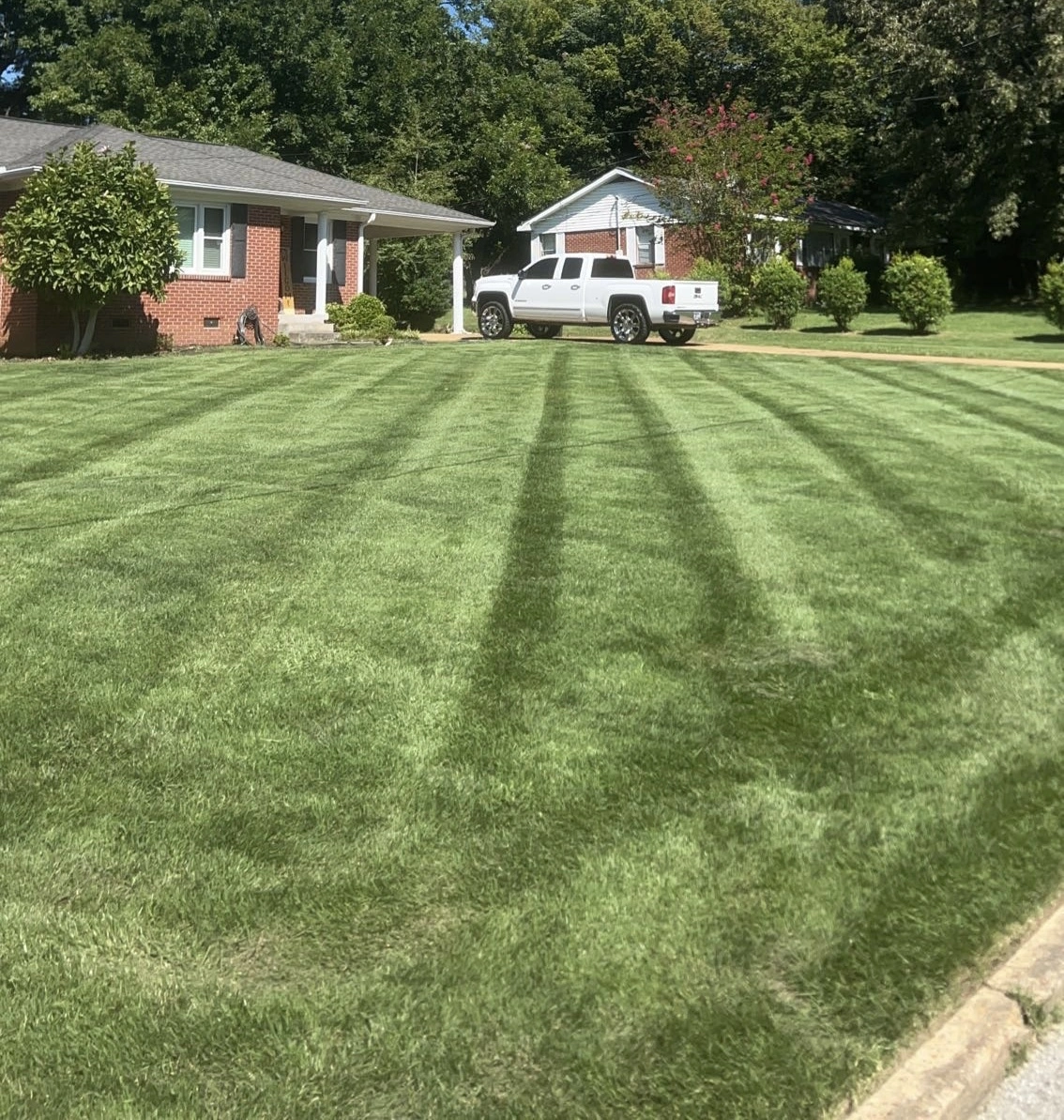 Recently mowed, trimmed, and edged lawn at a home in Ripley, TN.